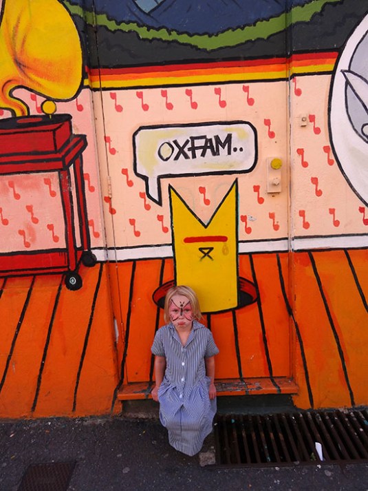 Lara outside the backdoor at Oxfam