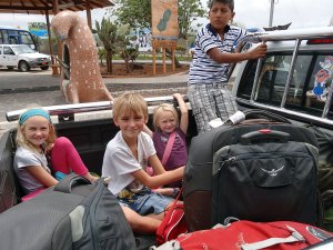 San-Cristobal-Airport-Pickup Ben Zoe and Lara in the back of a pickup truck