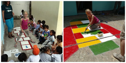 Zoe helps paint hopskotch games at the Kinder school with quite an audience at breaktimes!  