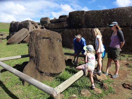 Paul holds the kids' full attention as he explains the tragedy of the Moais quite rapidly being eroded away but the winds and rains 
